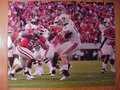 Picture: Georgia Bulldogs 8 X 10 photo of the defense against Auburn in the team's 45-7 win professionally double matted to 11 X 14.