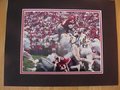 Picture: Herschel Walker Georgia Bulldogs hand-signed 8 X 10 photo against Tennessee professionally double matted to 11 X 14. The autograph is absolutely guaranteed authentic and comes with a Certificate of Authenticity.