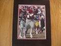 Picture: Herschel Walker Georgia Bulldogs hand-signed 8 X 10 photo against Georgia Tech professionally double matted to 11 X 14. The autograph is absolutely guaranteed authentic and comes with a Certificate of Authenticity.