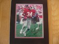 Picture: Herschel Walker Georgia Bulldogs hand-signed 8 X 10 photo professionally double matted to 11 X 14. The autograph is absolutely guaranteed authentic and comes with a Certificate of Authenticity.