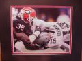 Picture: Marcus Howard of the Georgia Bulldogs sacks Colt Brennan Sugar Bowl Blackout original 8 X 10 photo professionally double matted to 11 X 14 so that it fits a standard frame.