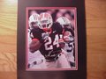 Picture: Knowhson Moreno hand-signed Georgia Bulldogs 8 X 10 photo of the "Blackout" game win over Auburn professionally double matted to 11 X 14 so that it fits a standard frame. The autograph is absolutely guaranteed authentic and comes with a Certificate of Authenticity from GeorgiaBulldogsPrints.com. We have only five left!