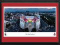 Picture: Ohio State Buckeyes 13.5 X 40 Panoramic Poster professionally double matted in team colors and framed to 18 X 44.The aerial photo captures the Ohio Stadium on the eve of the first regular season game of their 100th season of football. Affectionately known as the "Shoe", Ohio Stadium is one of the most recognizable landmarks in all of sports. Since the opening game against Ohio Wesleyan on October 7, 1922, more than 36 million fans have streamed through the stadium's gates. With a seating capacity of 102,780, Ohio Stadium is one of the largest stadiums in the world, the fourth largest on-campus facility in the nation and is listed in the National Register of Historic Places.